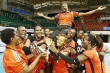 Malkia Strikers players carry their coach, Paul Bitok, in celebration after clinching their Olympics ticket.